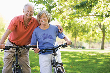 Photo of a man and woman on bicycles. Link to Life Stage Gift Planner Ages 60-70 Situations. Photo of a man and woman on bicycles. Link to Life Stage Gift Planner Ages 60-70 Situations.